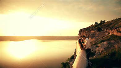 Wedding couple on the beach at sunset