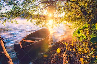 Boat in lake, sunrise