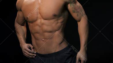 Close up man showing his muscular torso