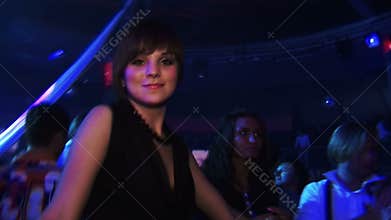 Boys and girls dancing at a party at the club