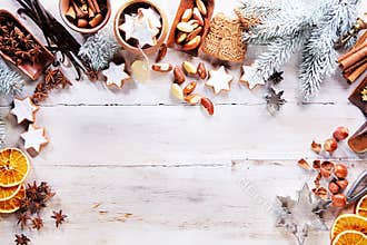Christmas frame with spices, nuts and biscuits
