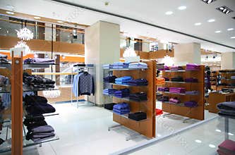 Clothing on shelfs in store