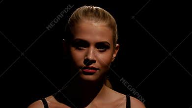 Beautiful model with professional make up. Black. Closeup