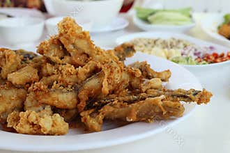 Complementing fish recipe - deep fried fish served with spices, vegetable and special sauce.