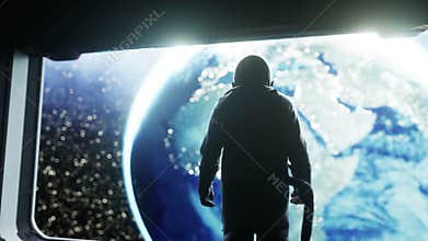 Alone astronaut in futuristic space corridor, room. view of the earth. cinematic 4k footage.