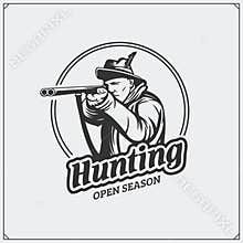 Hunting club emblem. Hunter with a gun.