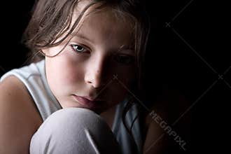 Young Child Looking Sad