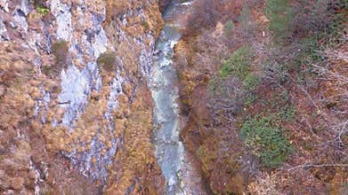 Beautiful autumn alpine landscape with Zmuttbach creek near Zermatt