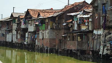 Slum area on the riverbank in Jakarta. Indonesia.