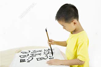 A child writing Chinese Calligraphy