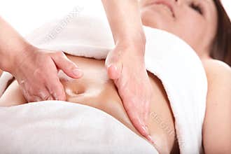Beautiful girl having stomach massage.