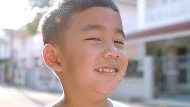 Close up face of cheerful asian children happiness emotion standing outdoor