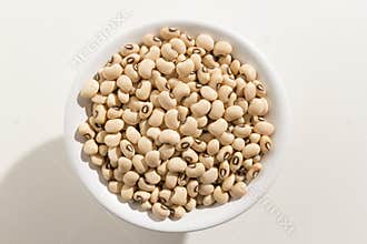 Black Eyed Pea legume. Top view of grains in a bowl. White background