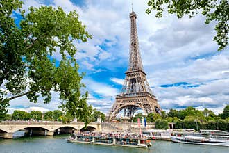The Eiffel Tower and cruise boats on the river Seine in Paris