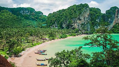 Hat Tom Sai Beach with long tail boats on the beach. Railay travel destination near Ao Nang, Krabi, Thailand