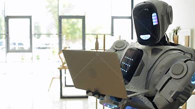 Smart robot browsing internet on laptop