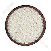 Basmati rice groats in wooden bowl isolated on white background. Top view