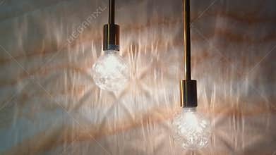Shadows on the wall from a light bulb