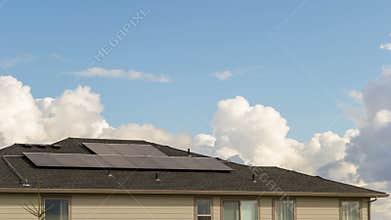 Timelapse of clouds over a home with a Solar Panel system installed on roof 4k