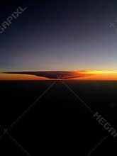 Dramatic sunset clouds from plane