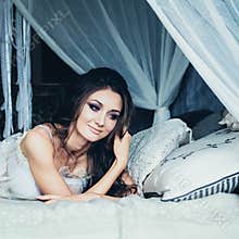 Beautiful Young Bride with Wedding Hair Resting at Home