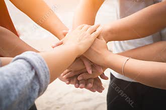 Closeup United hands on the sea background. Friendship, Teamwork