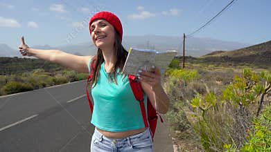 Traveler woman hitchhiking on a sunny road and walking. Backpacker woman looking for a ride to start a journey on a