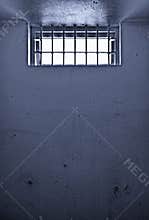 Old prison cell with barred window