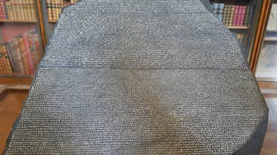A close up of a replica of the famous Rosetta Stone