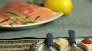 Woman cooking salmon fish at home set