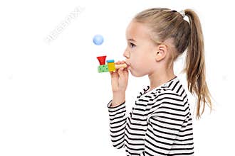 Cute young girl making special exercises at speech therapy office. Child speech therapy concept on white background.