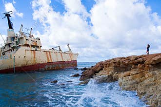 Old ship wreck and girl. Blue water beach. Travel photo 2018, d