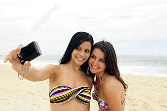 Girls taking photo with cellphone