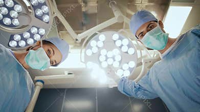 Surgeon setting the surgical light during an operation
