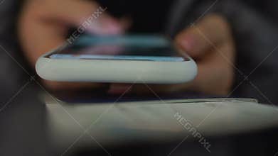 Girl holding passport and registering for visa application online, closeup