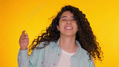 Female having fun. She smiling, hair flutter beautifully. Amazing positive footage. Girl moves to the rhythm of music