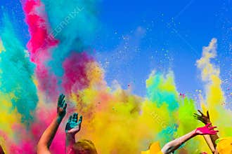 Crowd throws colored powder at holi festival