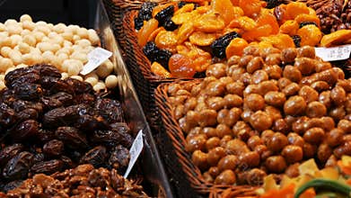 Mixture of dates dry fruits Raisins and nuts in the market La Boqueria in Barcelona,Spain