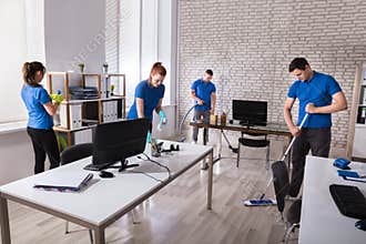 Janitors Cleaning The Office
