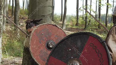 Medieval Warriors of Vikings are fighting during attack. Close-up