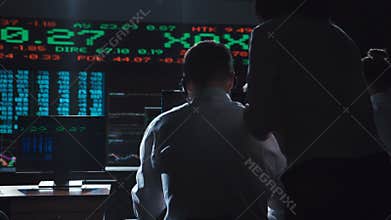Traders analyzing data on exchange