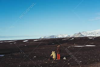Young adventurous couple taking a break while traveling in Iceland at wintertime. Couple lifestyle concept