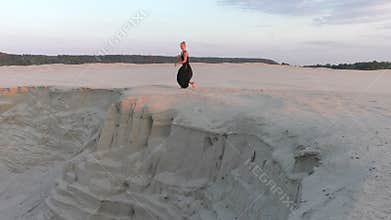 Dancer jumps on the edge of the abyss.
