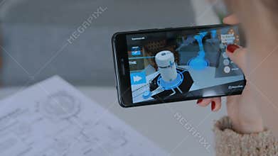 Woman using smartphone with augmented reality app