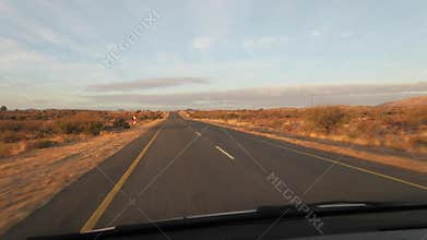Driving along a tar highway in the Northern Cape of South Africa