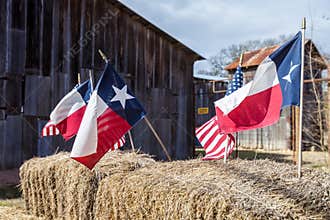 The American and Texas flags arranged on straw bales, independence day decoration