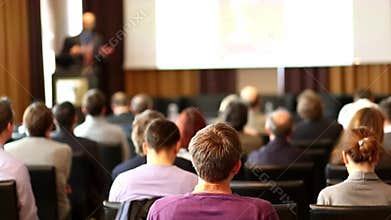 Public speaker giving talk at business event.