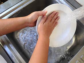 Dish washing on the sink.