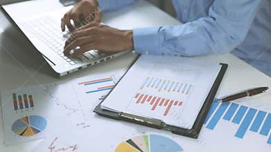 Business analysis - man working with financial data charts