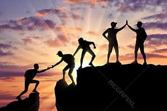 Conceptual scene of alpinists and teamwork